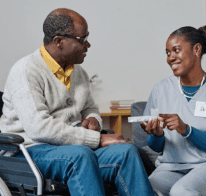 A caregiver supporting a community member with healthcare